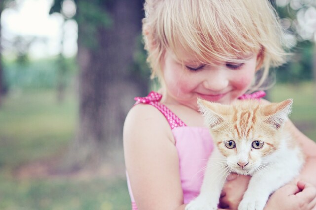 Girl and pet kitten